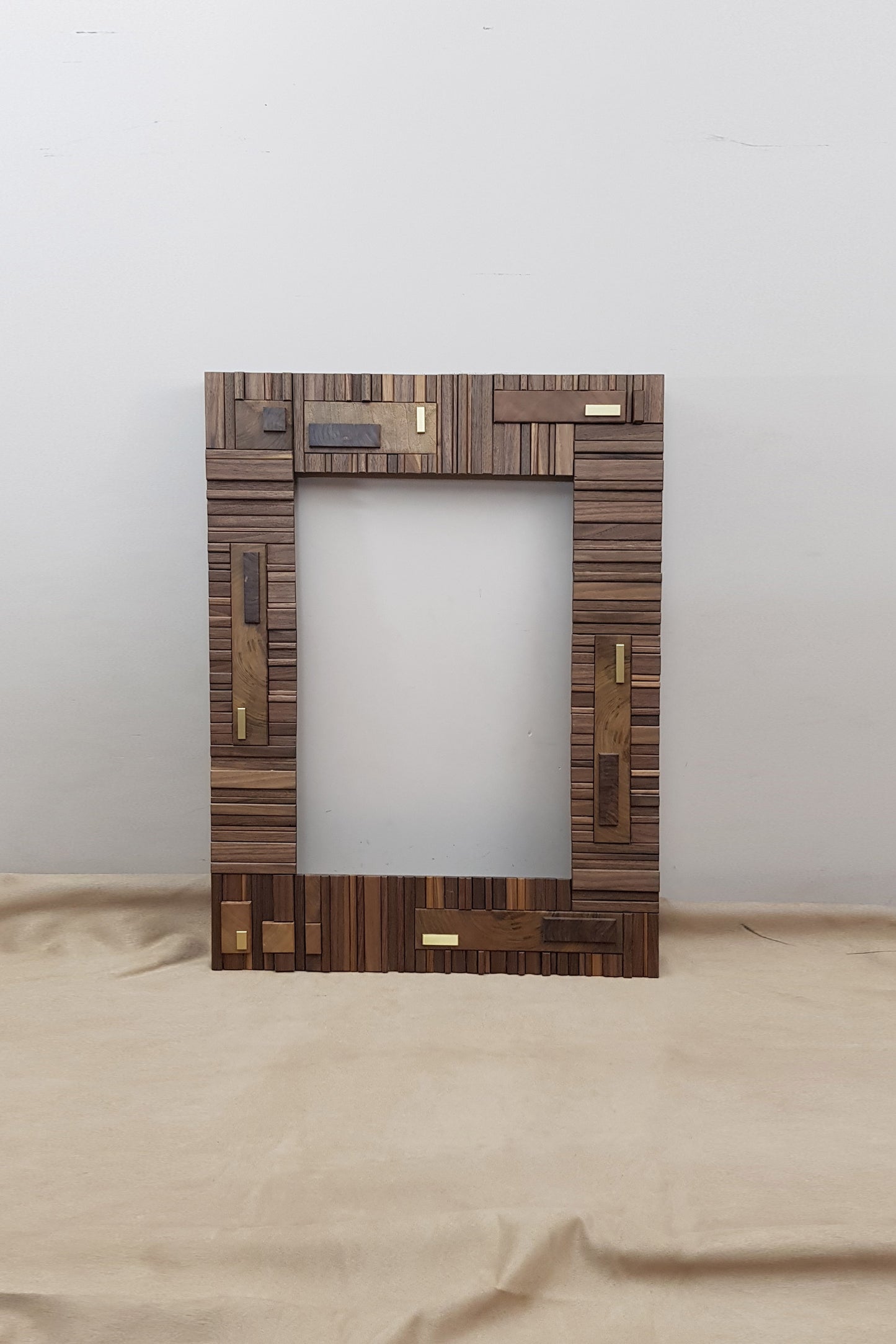 Handmade centrepiece statement mirror frame in walnut and brass