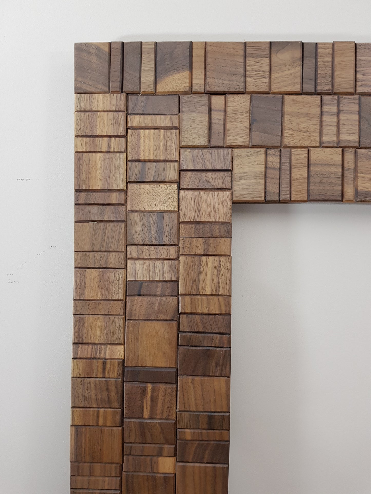 Walnut and brass mirror frame.