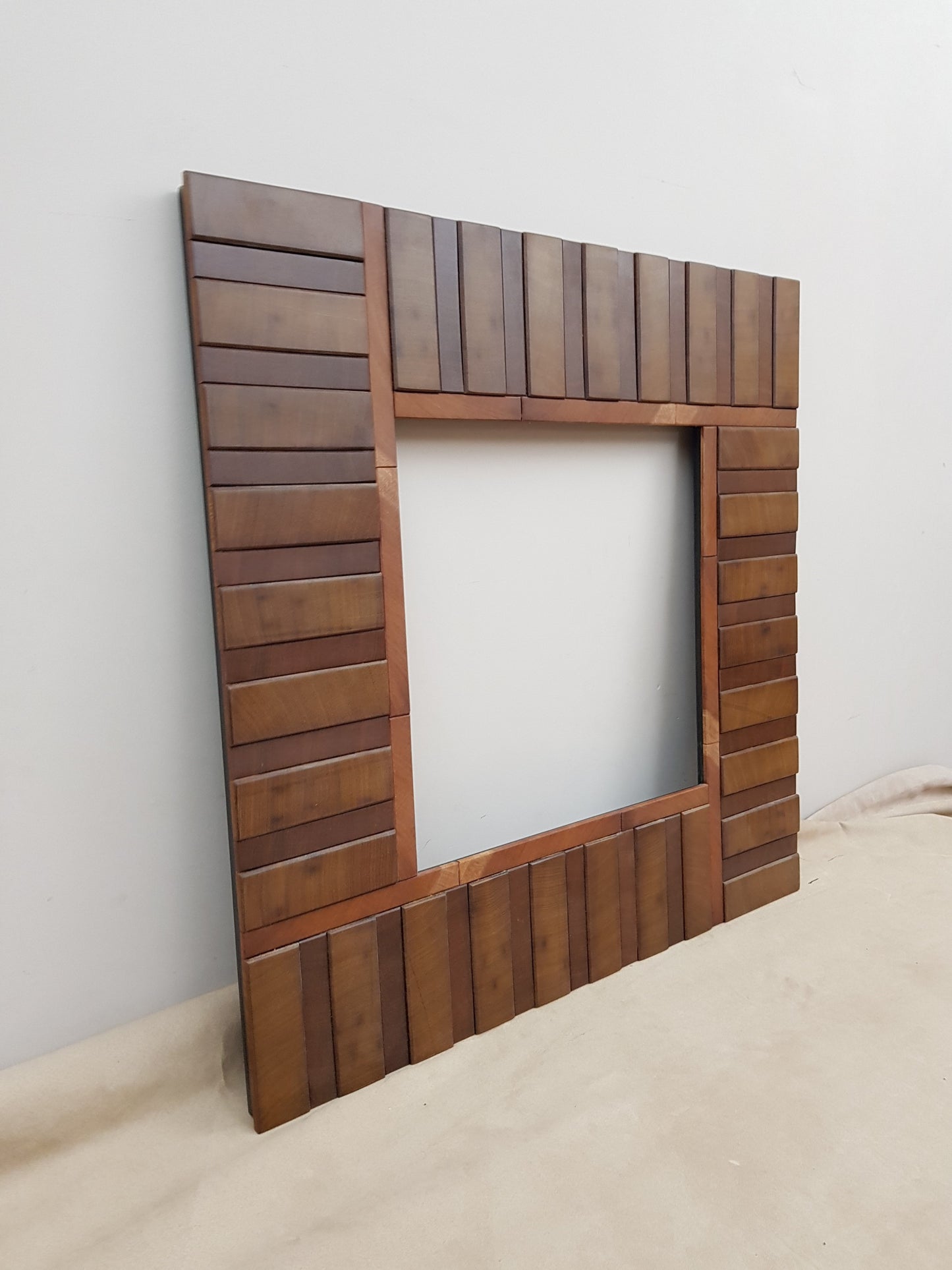 Square wooden mirror frame in end grain mahogany.