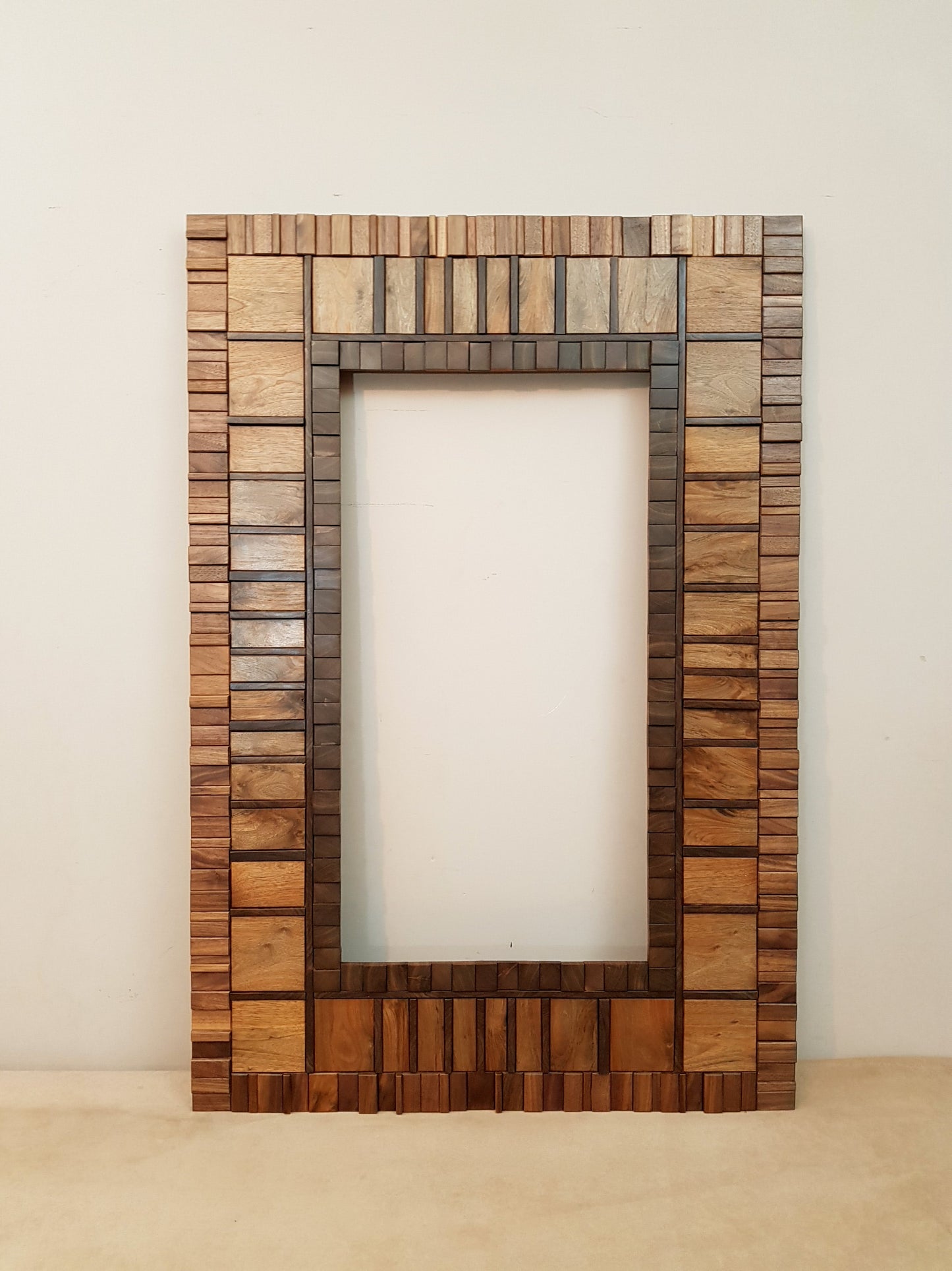 Large mirror frame in end grain mahogany.