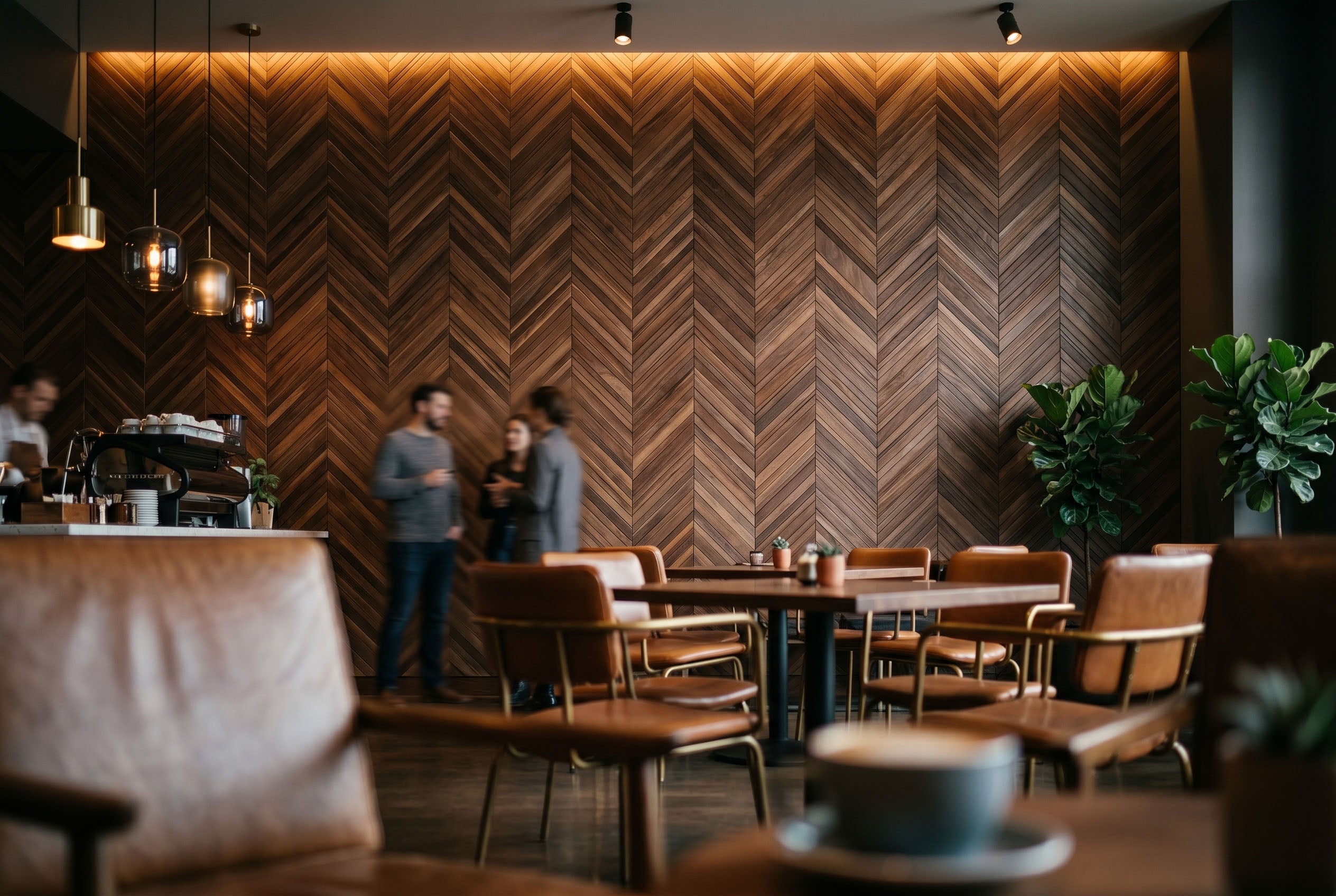 Modern cafe interior with wooden wall pattern and patrons.