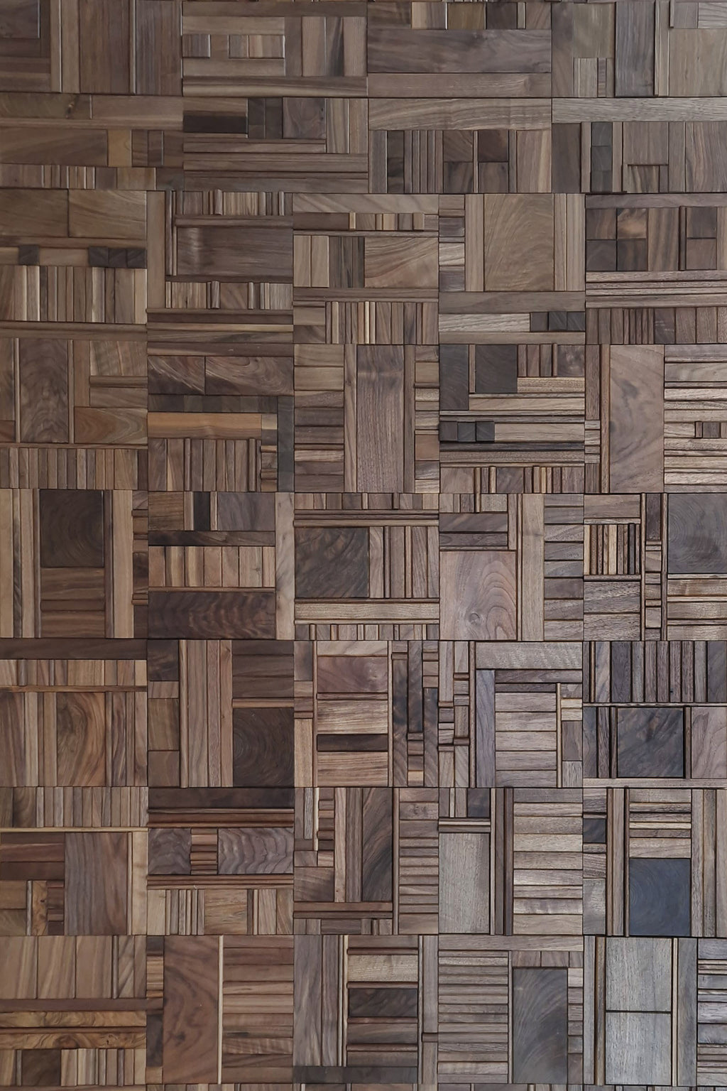 Black walnut wooden wall tiles in random pattern