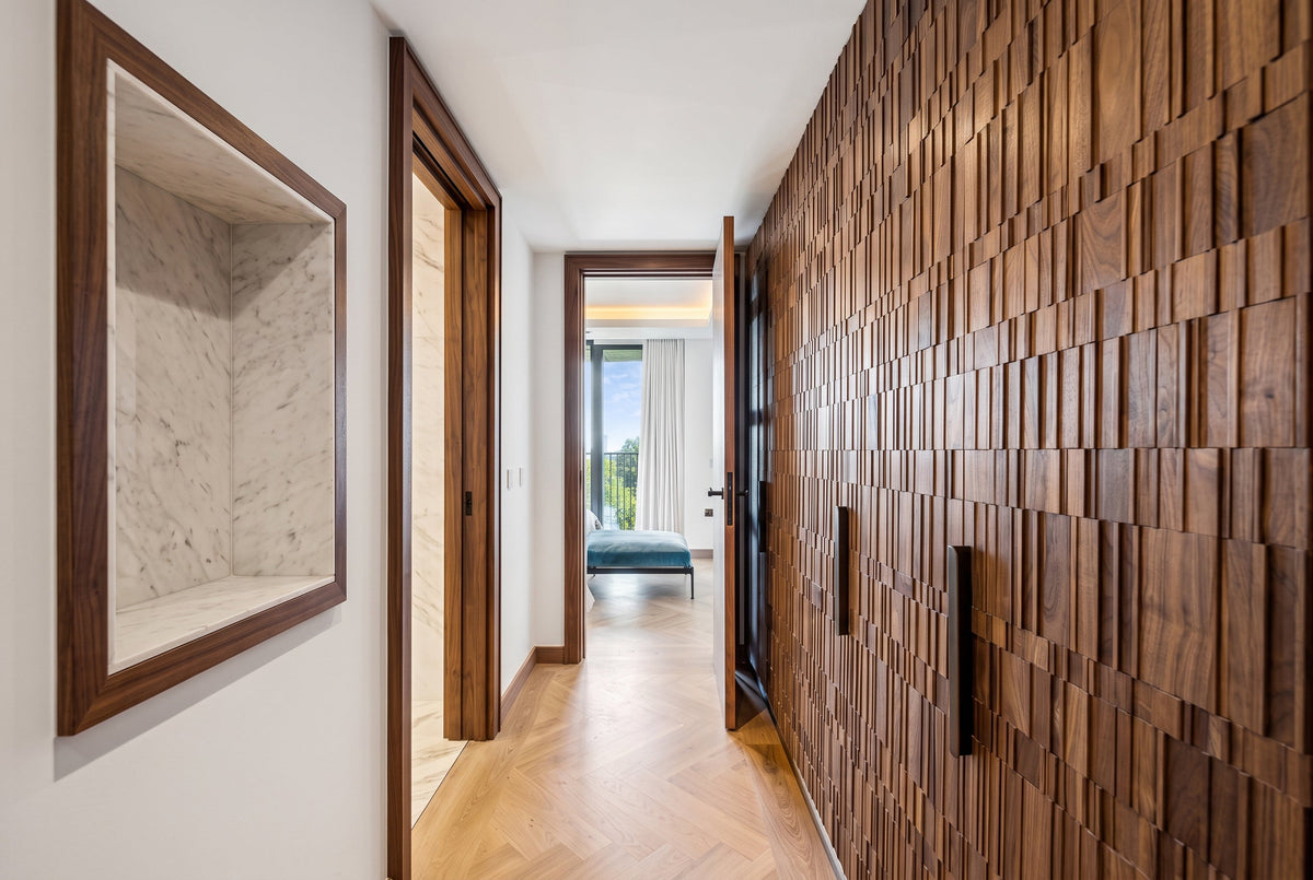 A modern interior hallway with a walnut  wood panelling in unique linear design 