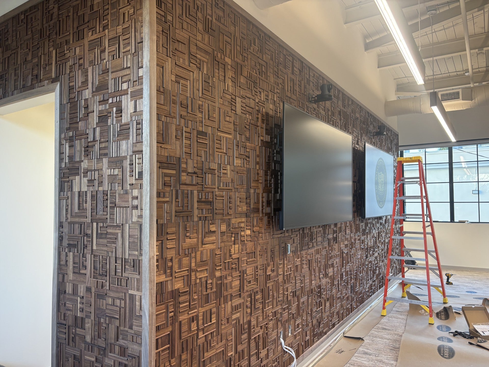 Wall with patterned wood paneling in back walnut