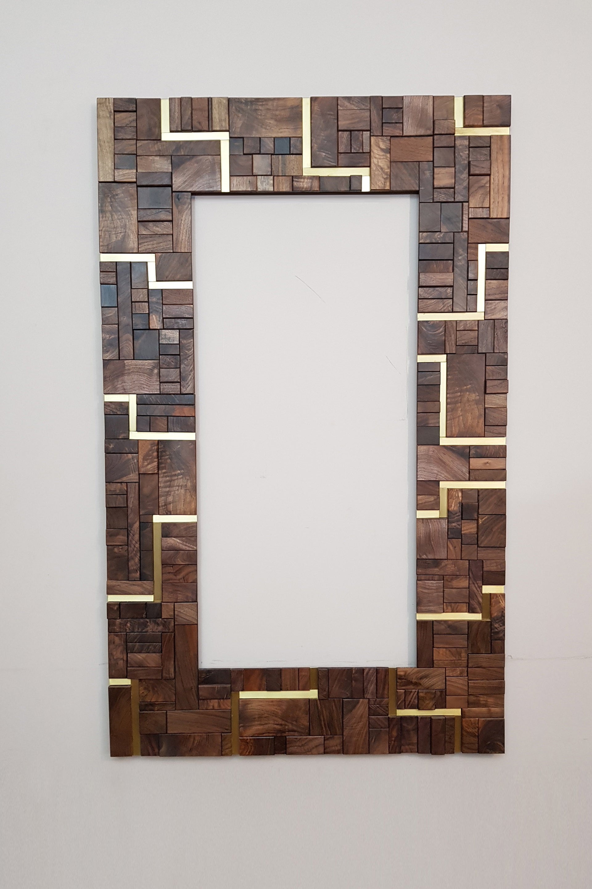 Large centrepiece statement mirror frame in figured walnut and brass