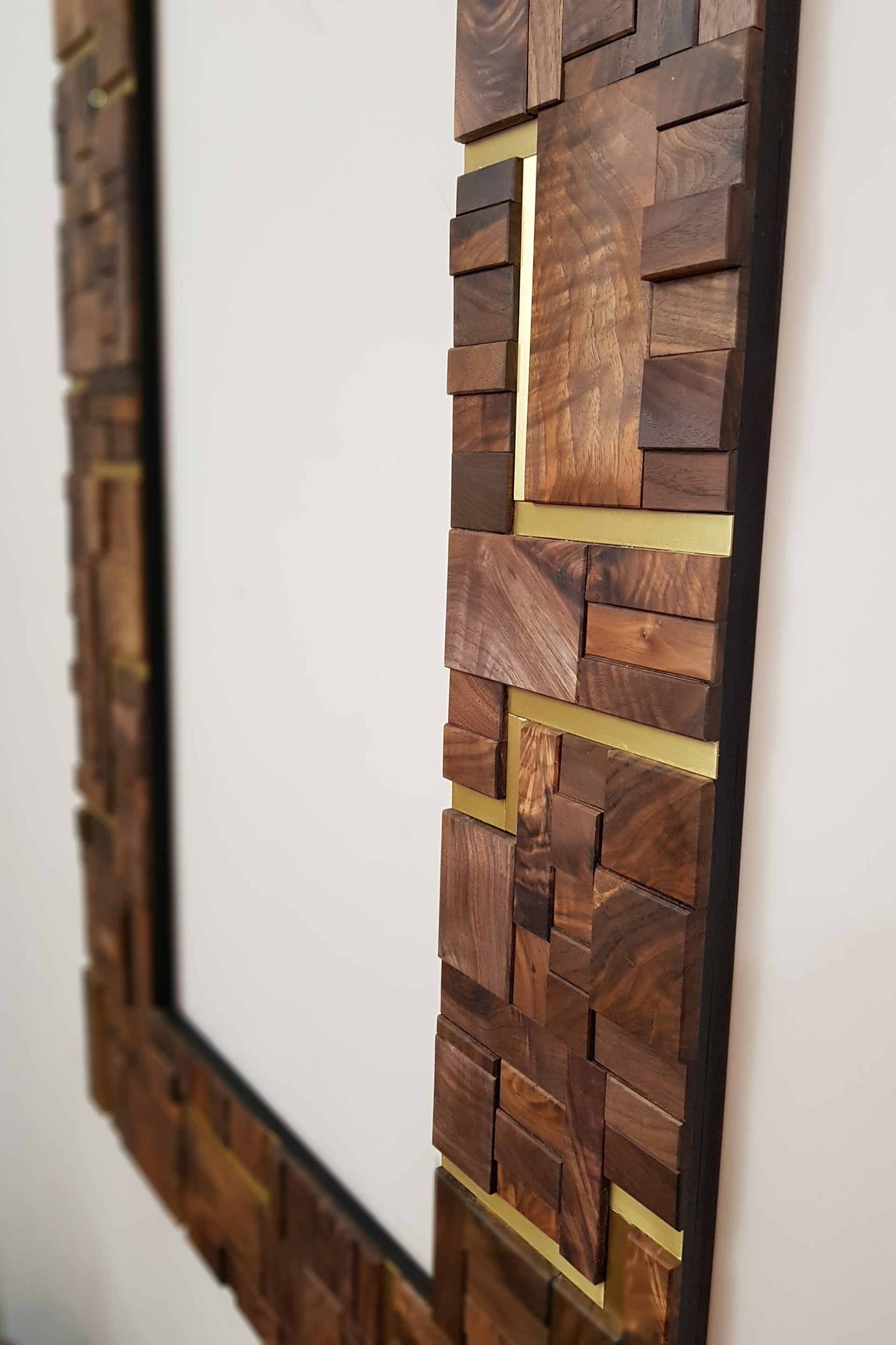 Large centrepiece statement mirror frame in figured walnut and brass