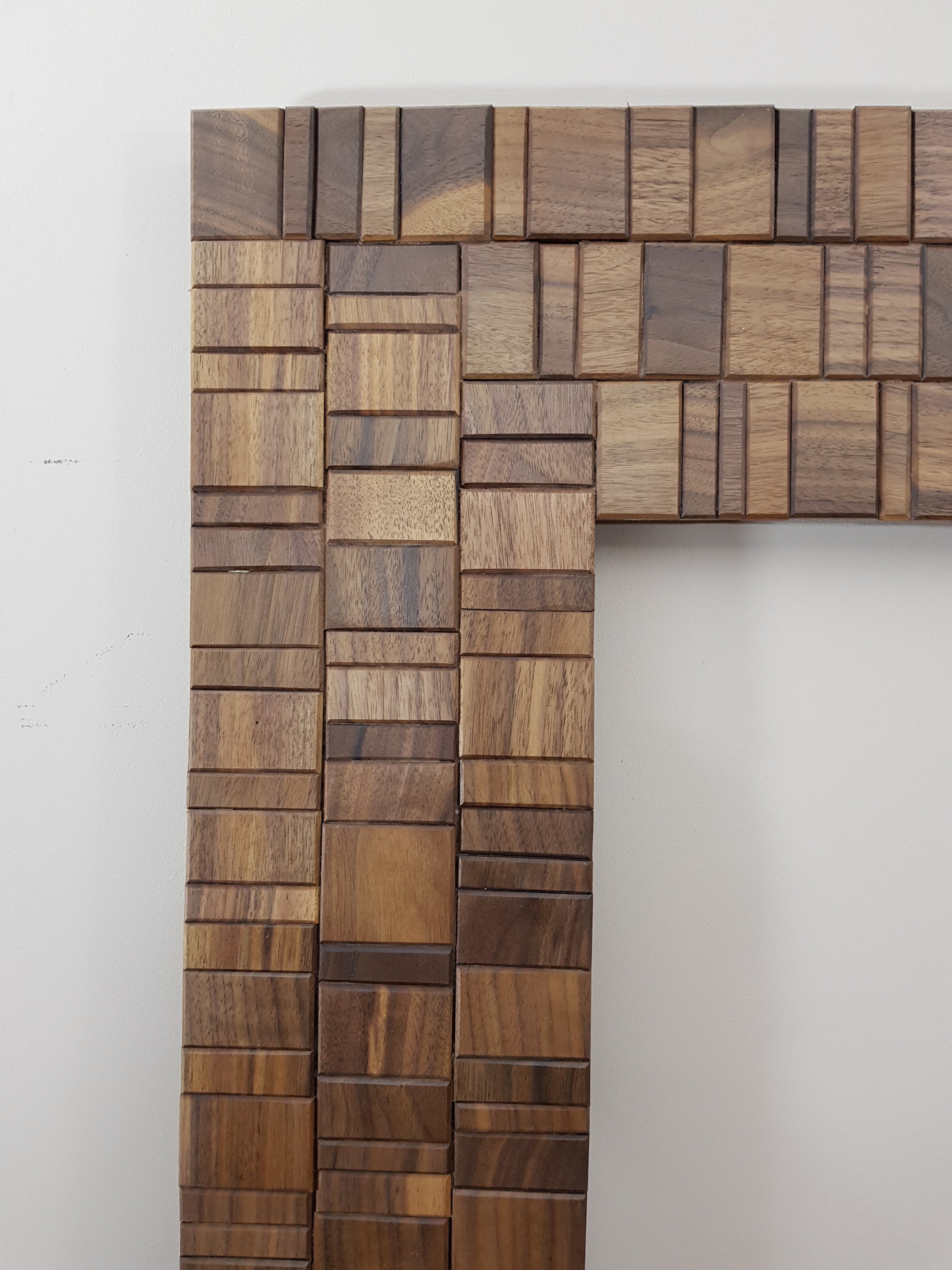 Walnut and brass mirror frame.