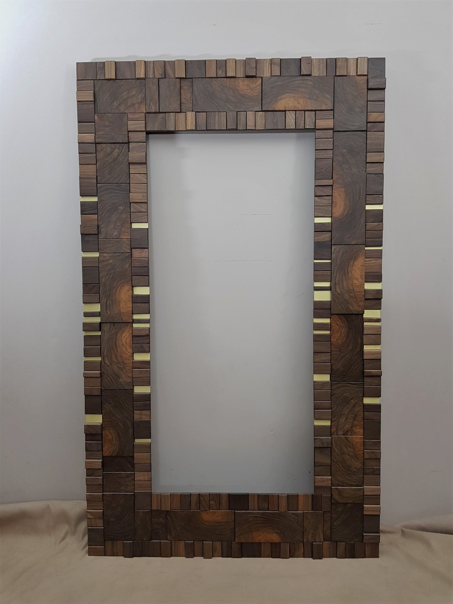 Handmade centrepiece statement mirror frame in end grain figured walnut and brass