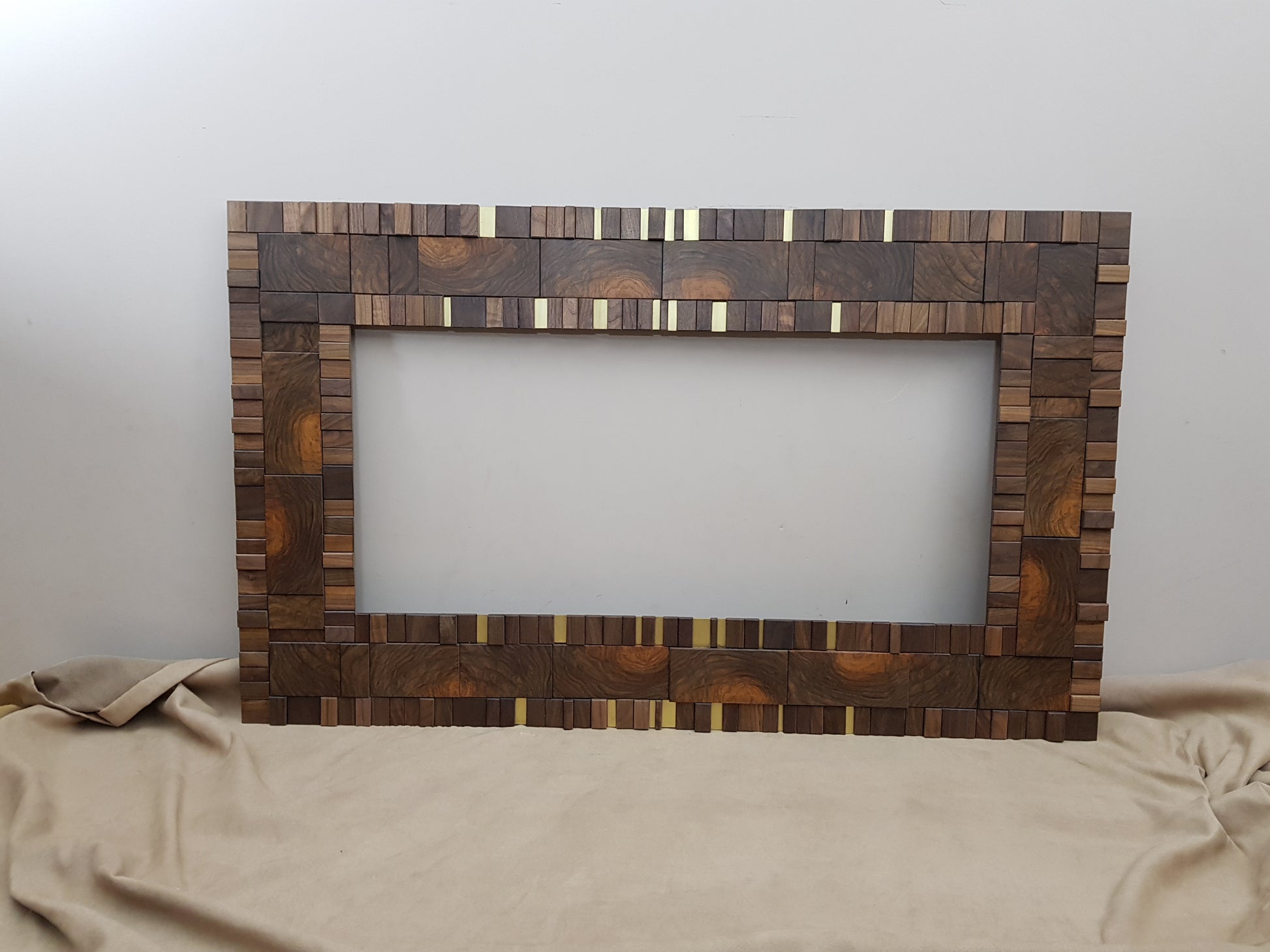 Handmade centrepiece statement mirror frame in end grain figured walnut and brass