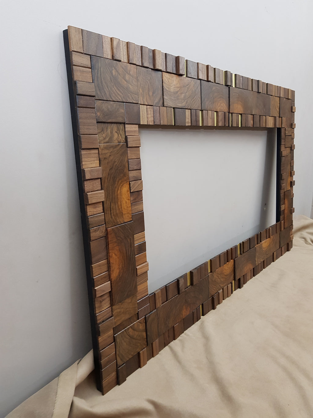 Handmade centrepiece statement mirror frame in end grain figured walnut and brass