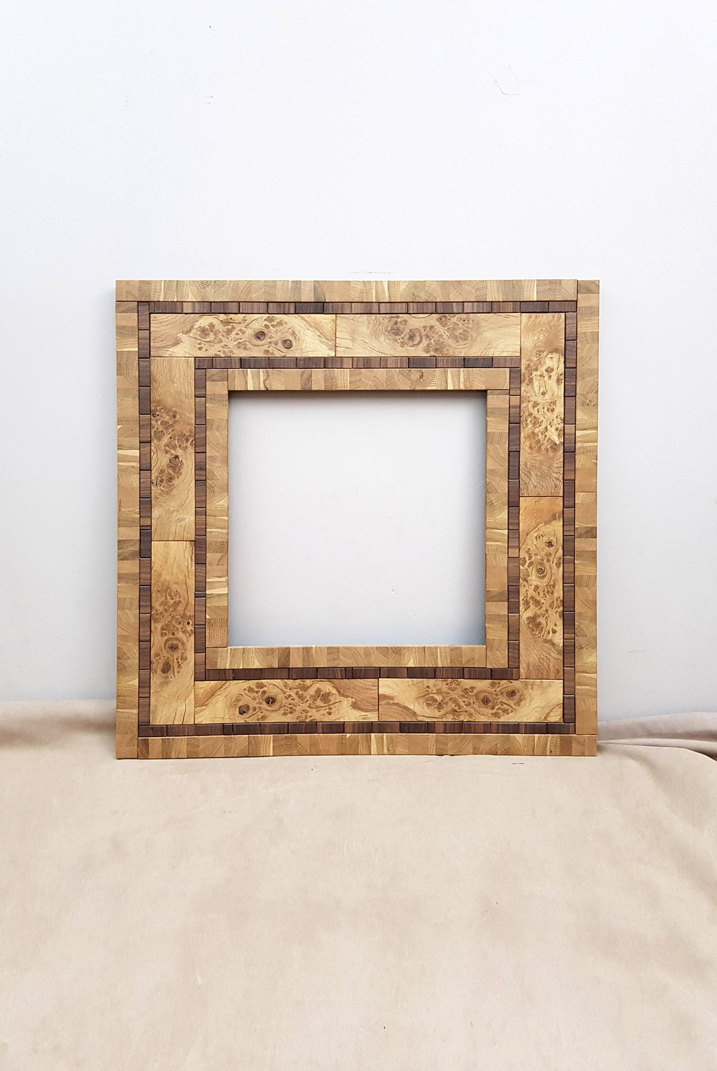 Centrepiece statement mirror frame in figured oak and walnut
