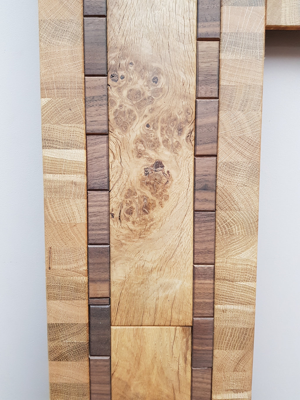 Centrepiece statement mirror frame in figured oak and walnut