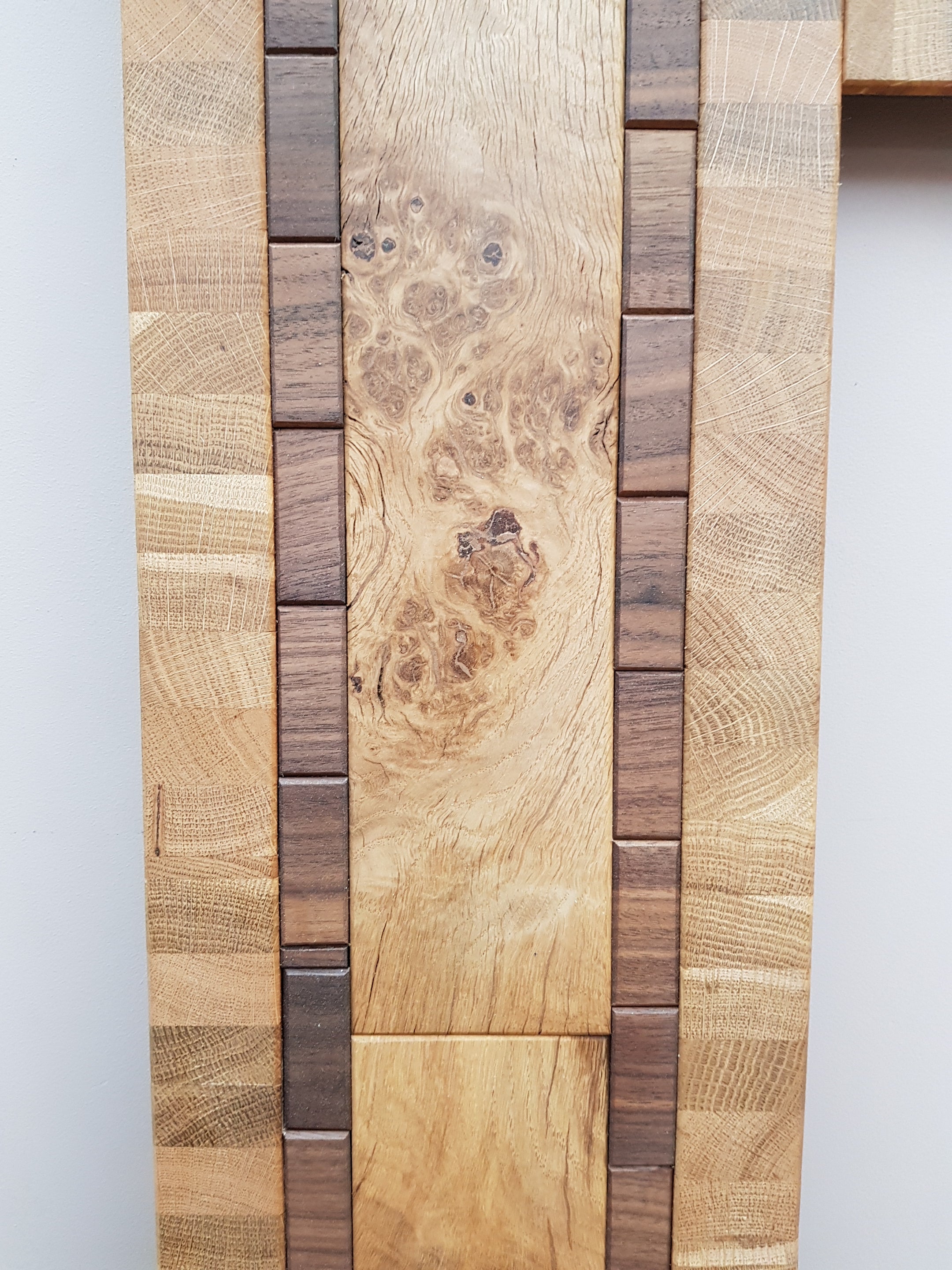 Centrepiece statement mirror frame in figured oak and walnut