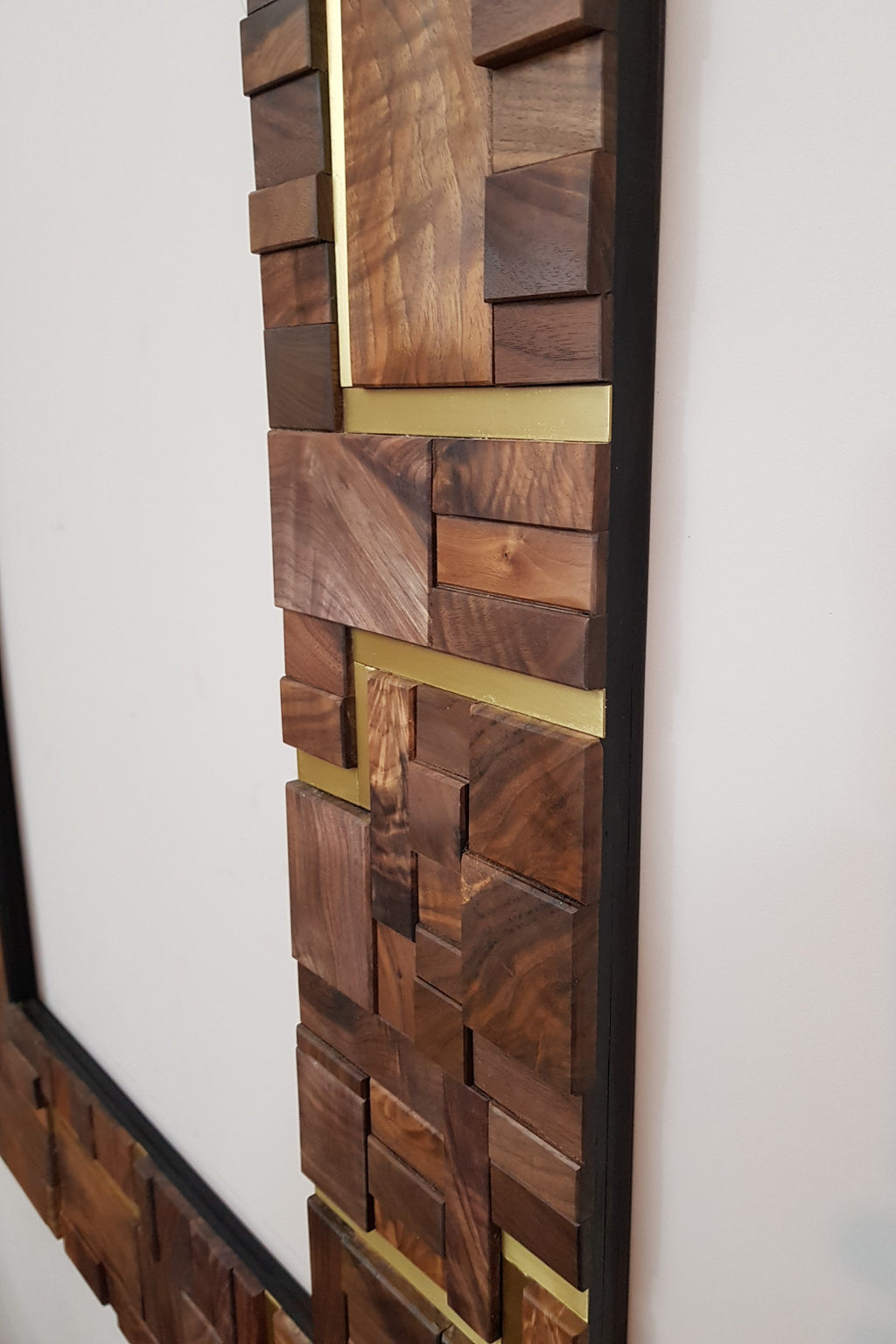 Large centrepiece statement mirror frame in figured walnut and brass