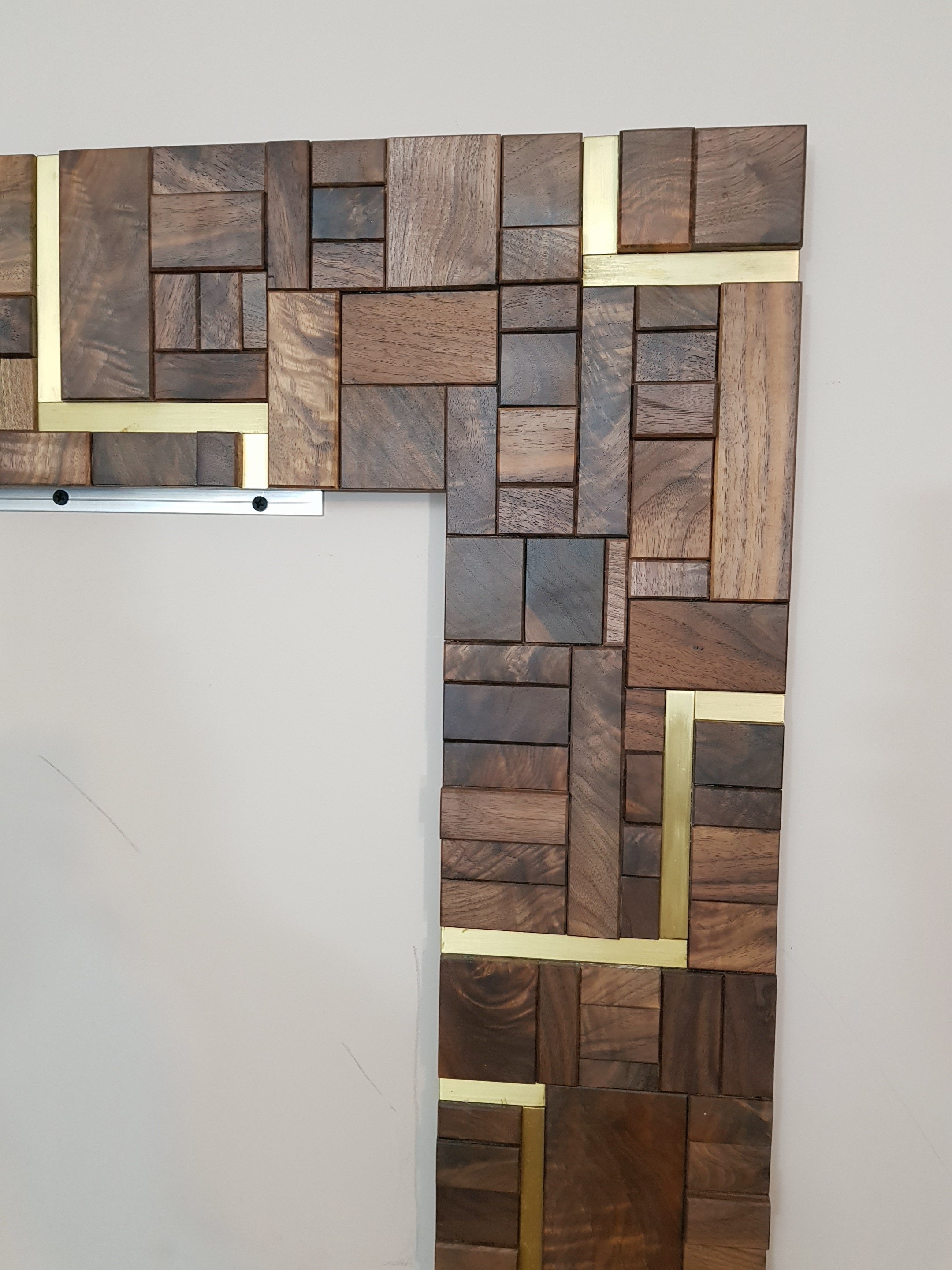 Large centrepiece statement mirror frame in figured walnut and brass