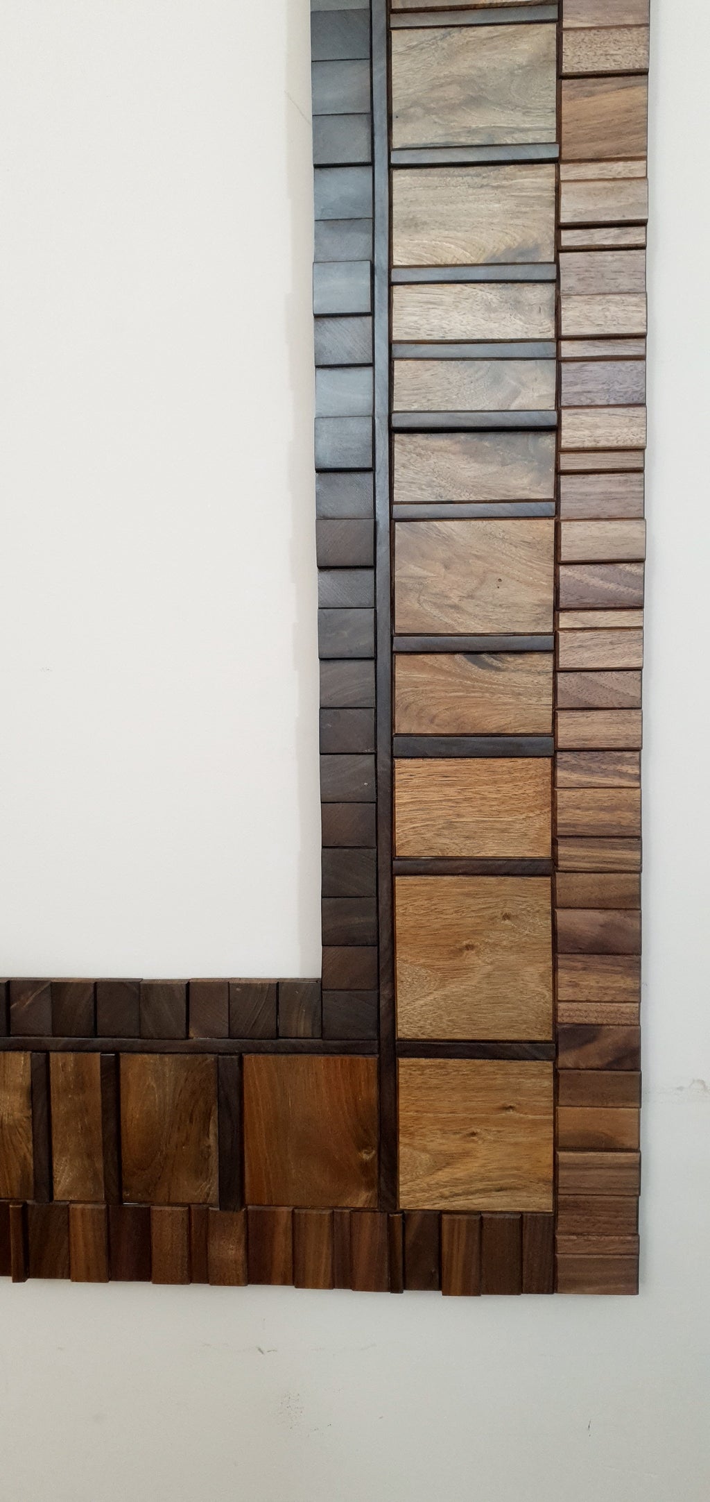 Large mirror frame in end grain mahogany.