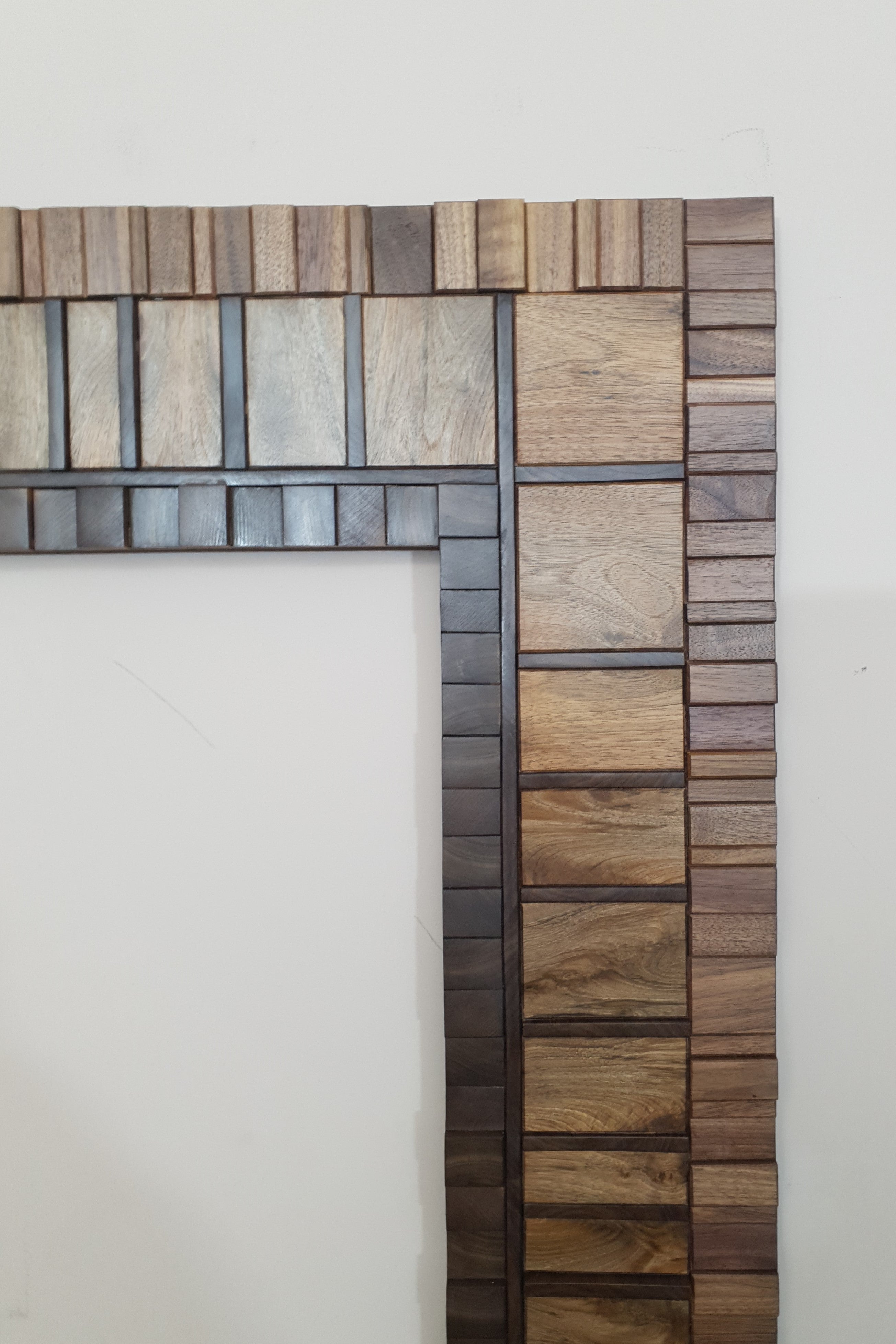 Large mirror frame in end grain mahogany.