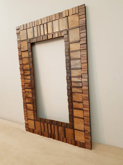 Large mirror frame in end grain mahogany.