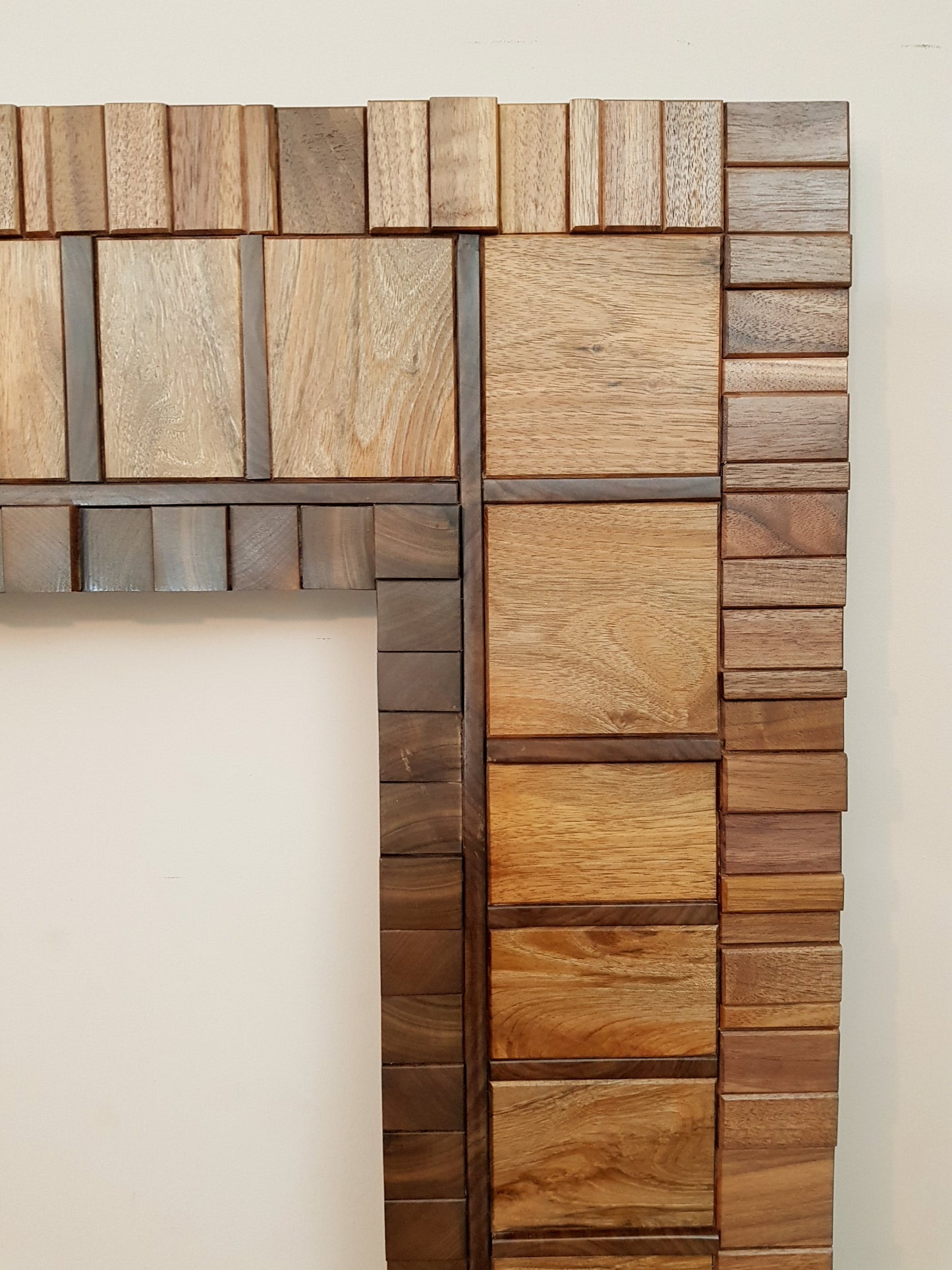 Large mirror frame in end grain mahogany.