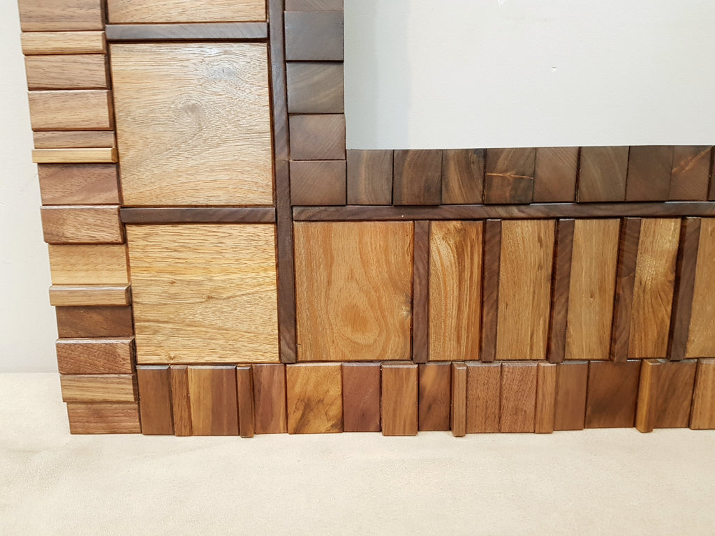 Large mirror frame in end grain mahogany.