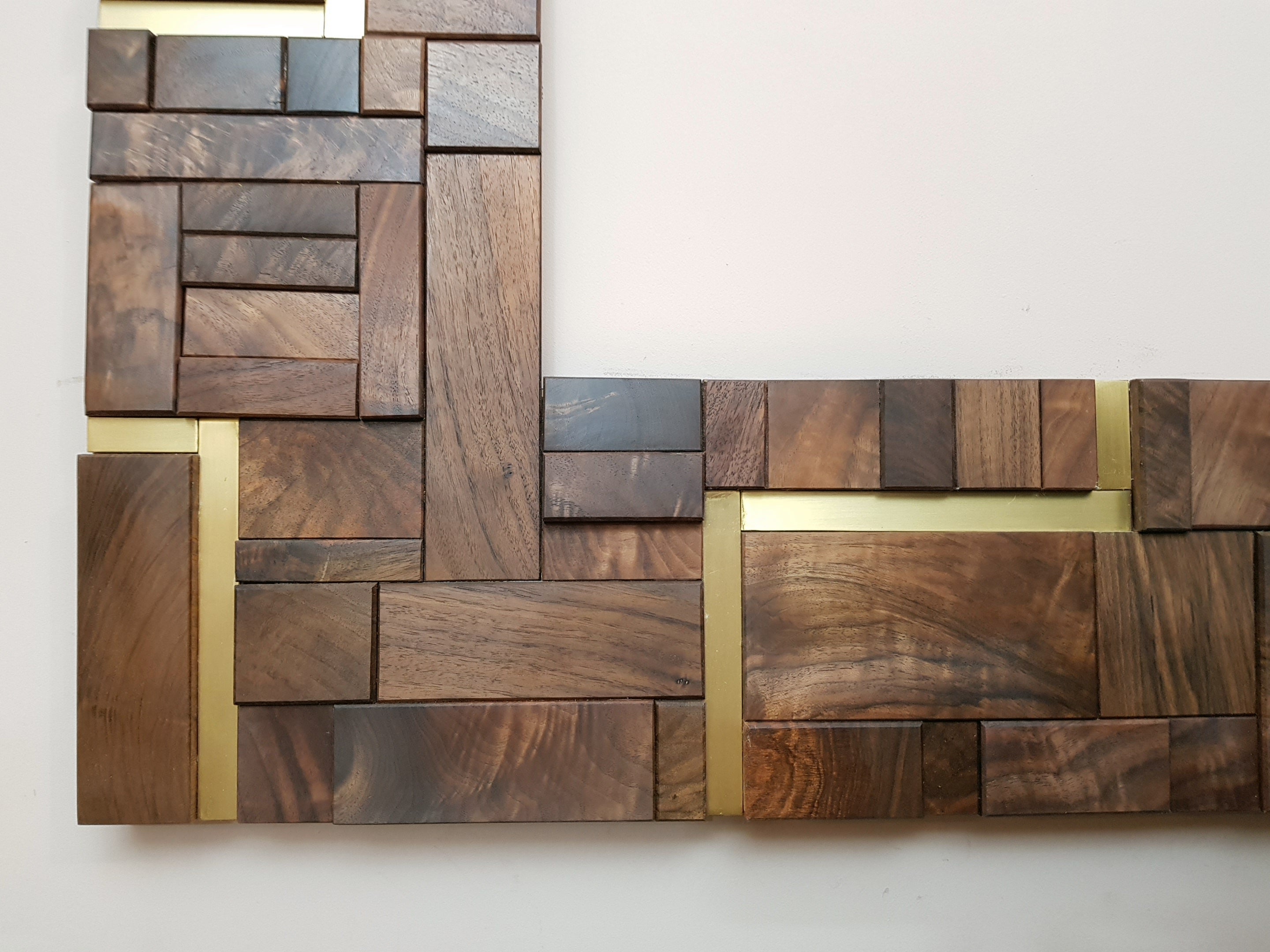 Large centrepiece statement mirror frame in figured walnut and brass