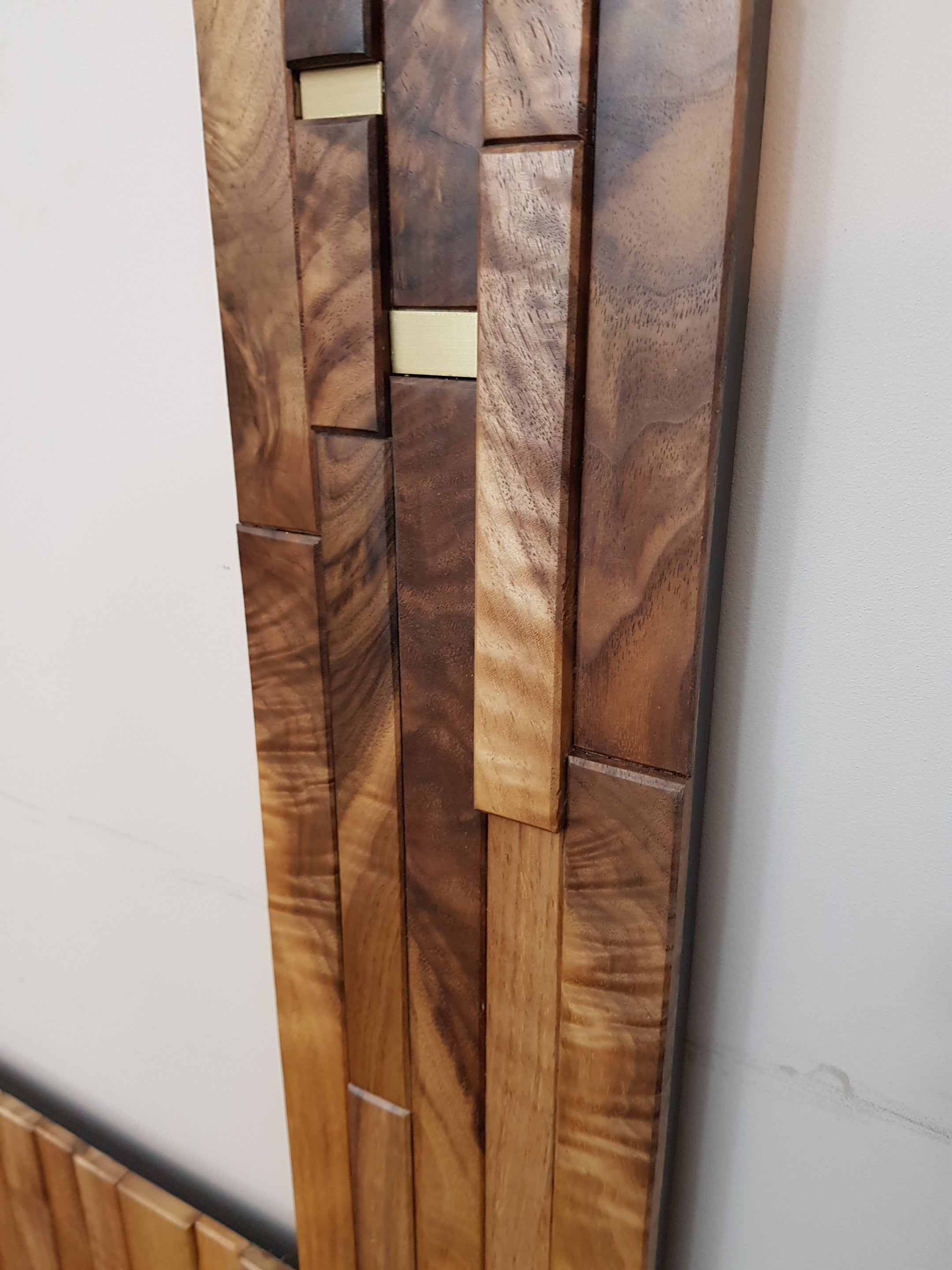 Modern centrepiece statement mirror frame in figured walnut and brass