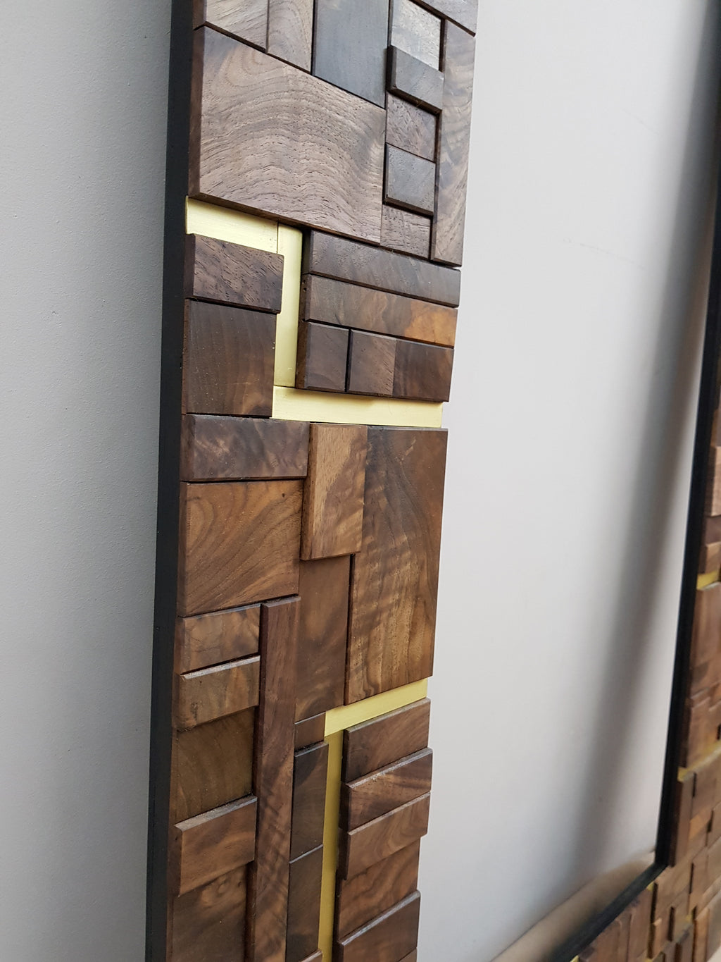 Large centrepiece statement mirror frame in figured walnut and brass