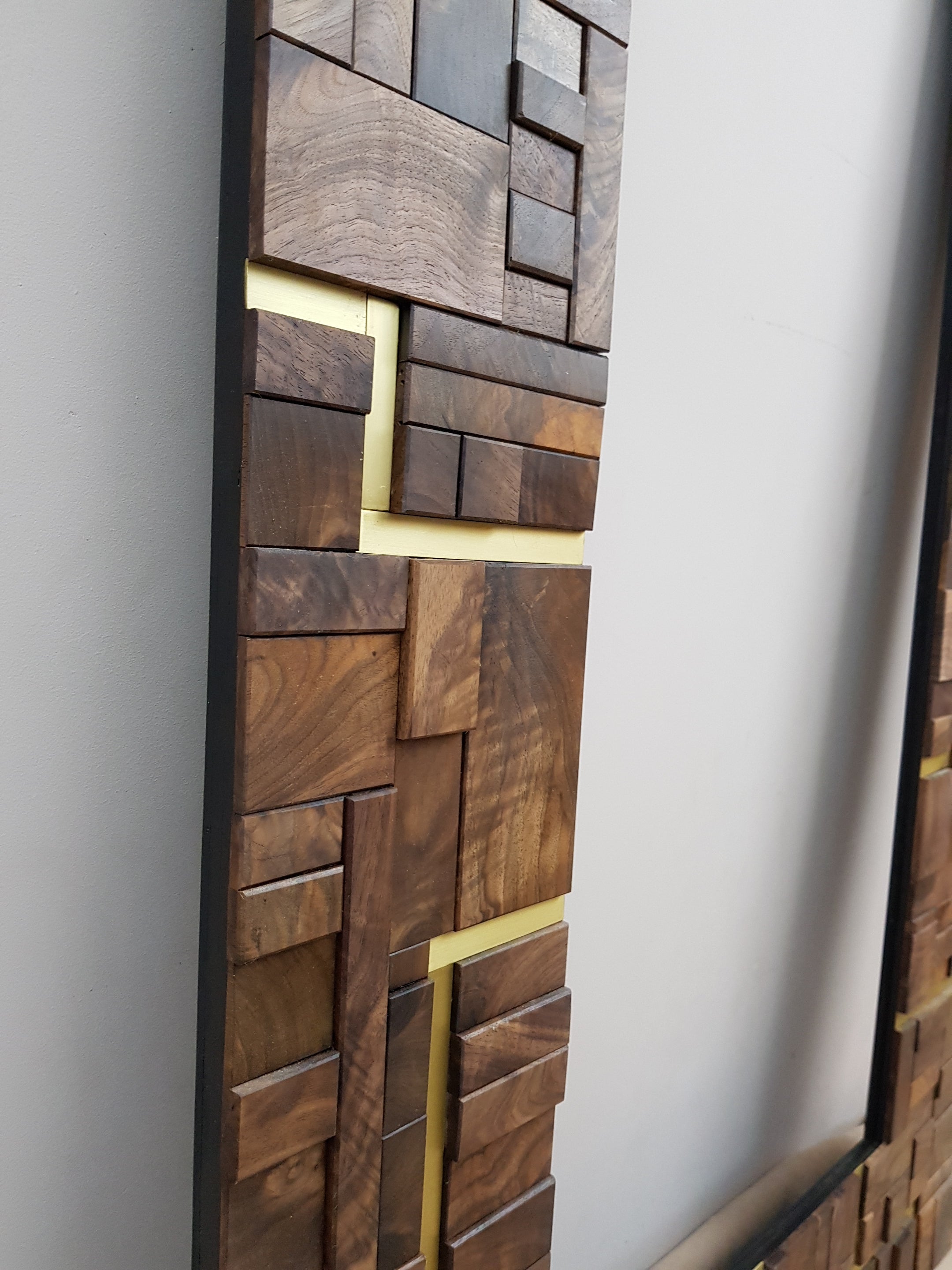 Large centrepiece statement mirror frame in figured walnut and brass