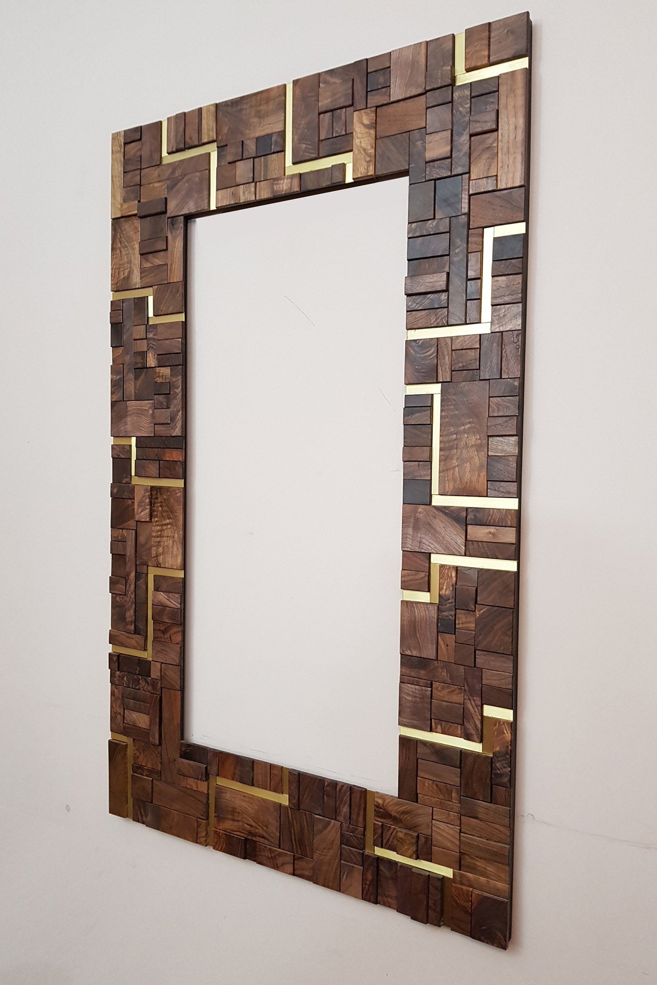 Large centrepiece statement mirror frame in figured walnut and brass